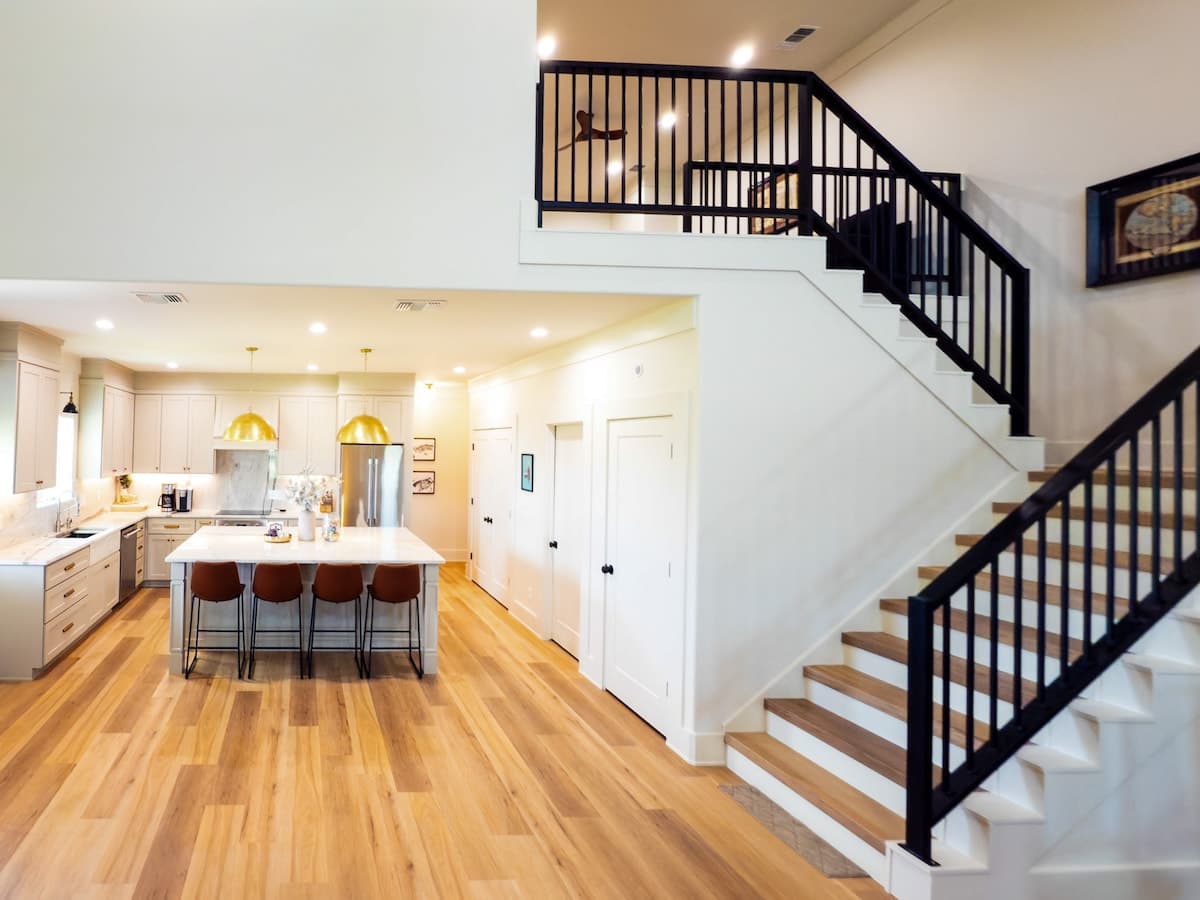 Open staircase with kitchen and loft view